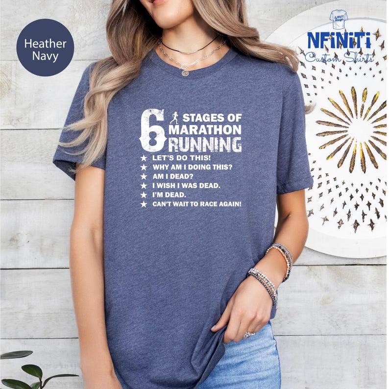 a woman wearing a t - shirt that says six stages of marathon running