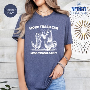 a woman wearing a t - shirt that says more trash can less trash can