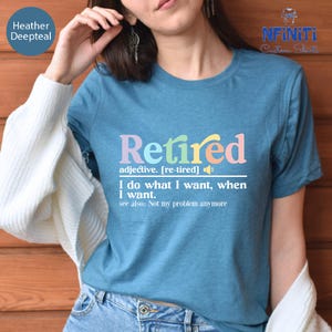 a woman wearing a t - shirt that says retired