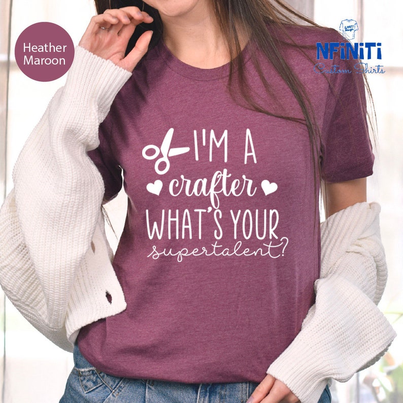 a woman wearing a t - shirt that says i'm a crater what '