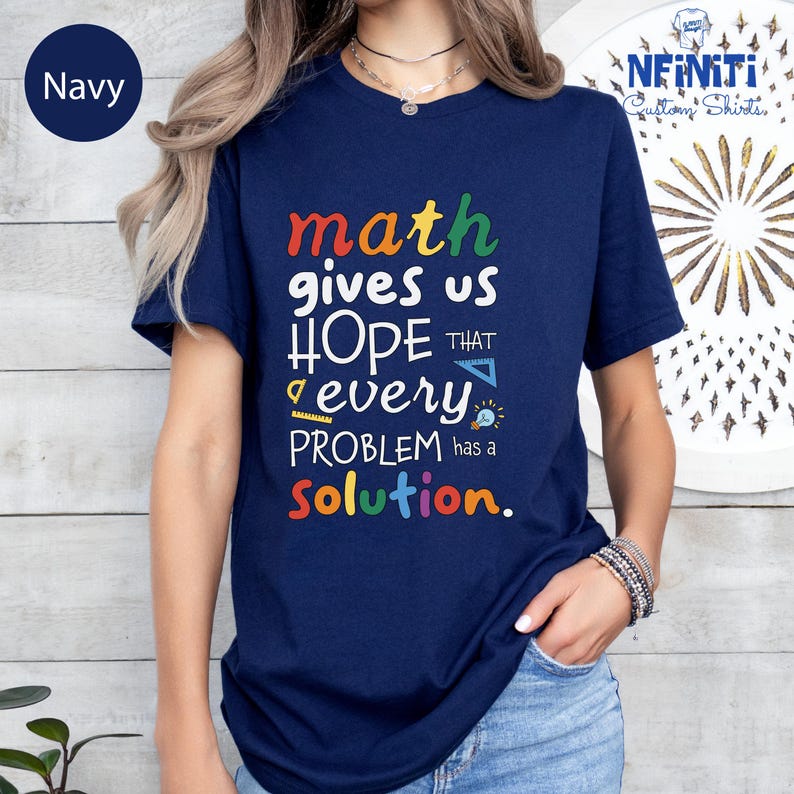 a woman wearing a t - shirt that says math gives us hope that every problem