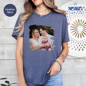 a woman wearing a t - shirt with a picture of a man and a woman