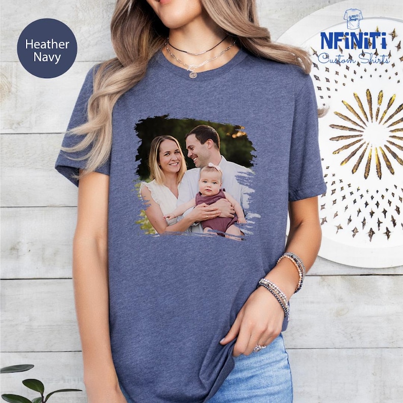 a woman wearing a t - shirt with a picture of a man and a woman