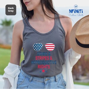a woman wearing a tank top that says obama and stripes and percolative rights