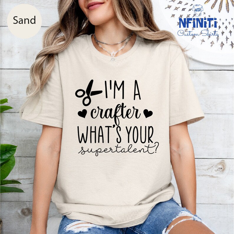 a woman wearing a t - shirt that says i'm a crafter what