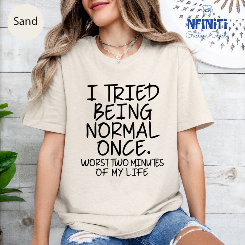 a woman wearing a t - shirt that says i tried being normal once