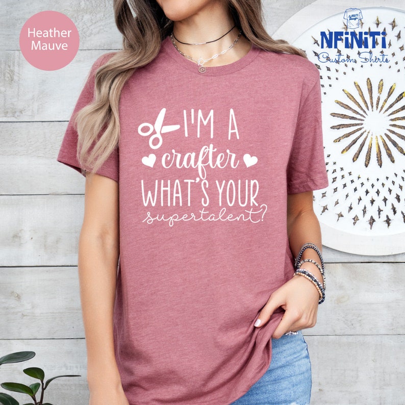 a woman wearing a t - shirt that says i'm a crafter what