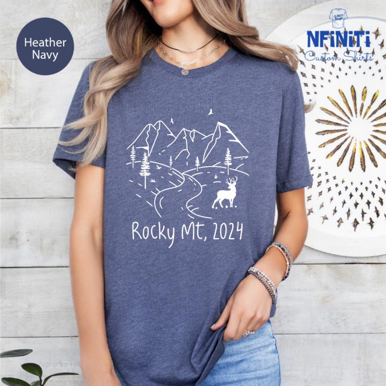 a woman wearing a t - shirt that says rocky mtn