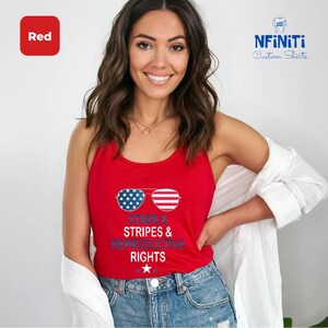 a woman wearing a red tank top that says stripes and rights