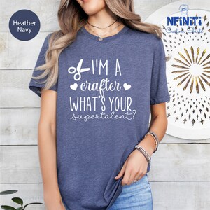 a woman wearing a t - shirt that says i'm a crafter what
