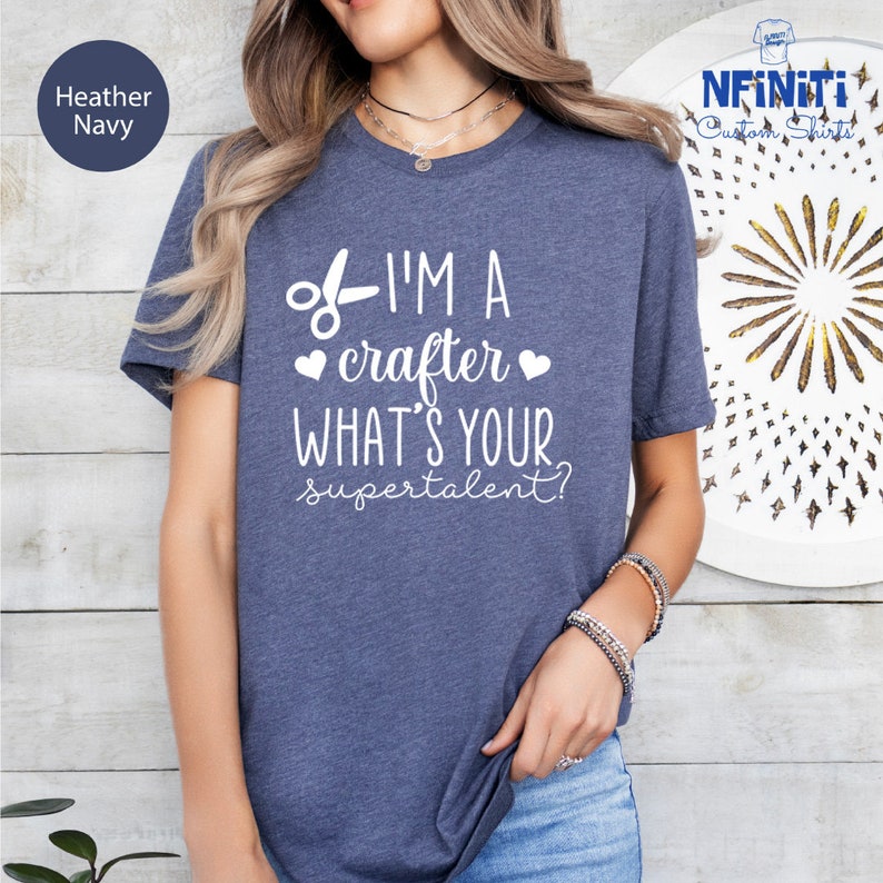 a woman wearing a t - shirt that says i'm a crafter what