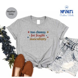 a t - shirt that says too chummy for fragile masculiniity