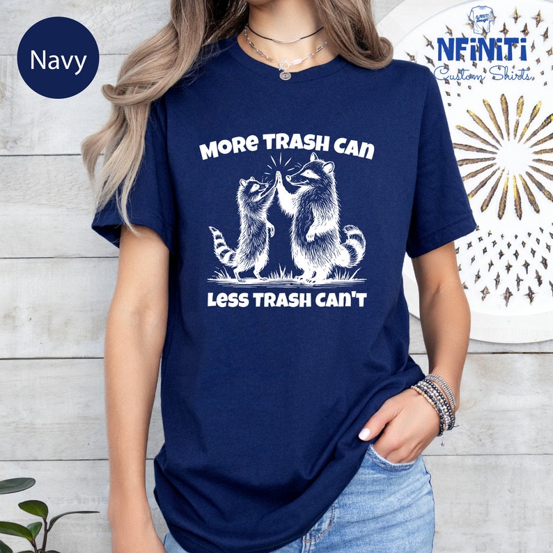 a woman wearing a t - shirt that says, more trash can less trash cat