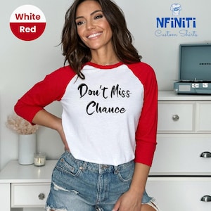 May include: A white and red baseball tee shirt with the text "Don't Miss Chance" printed in black on the front.