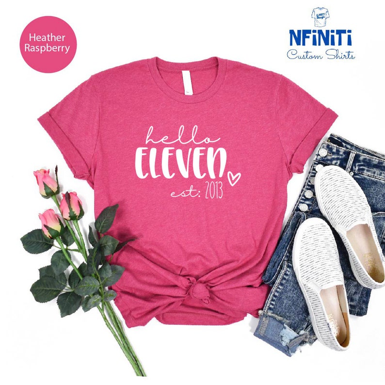 a women's t - shirt with the words hello eleven on it