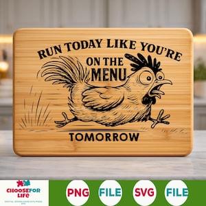 May include: A rectangular bamboo cutting board with a humorous illustration of a running chicken. The text reads "RUN TODAY LIKE YOU'RE ON THE MENU TOMORROW" in black. The board has a light brown color and a natural wood grain.