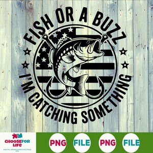 May include: A black and white graphic featuring the text "FISH OR A BUZZ I'M CATCHING SOMETHING" encircling a fish and hook design. The design incorporates stars and stripes, set against a wood-effect background.