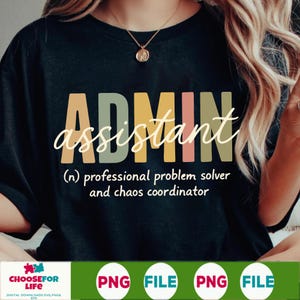 May include: Black t-shirt with the word "ADMIN" in colorful block letters, and "assistant" in cursive. Below, text reads "(n) professional problem solver and chaos coordinator."