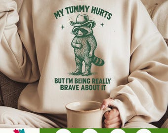 My Tummy Hurts But I'm Being Really Brave About It PNG – Funny Cowboy Raccoon Clipart, Digital Download Meme Art, Printable Humor File