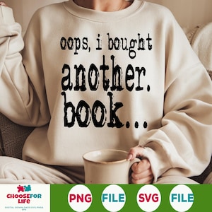 Puede incluir: Una sudadera blanca con el texto "oops, i bought another. book..." impreso en negro.