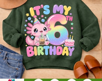 Puede incluir: Una sudadera verde oscuro con un gráfico de un ajolote rosa que lleva un gorro de fiesta y sostiene un té de burbujas. El texto IT'S MY 6TH BIRTHDAY aparece en letras coloridas junto a un gran número 6 de colores arcoíris y un pastel.