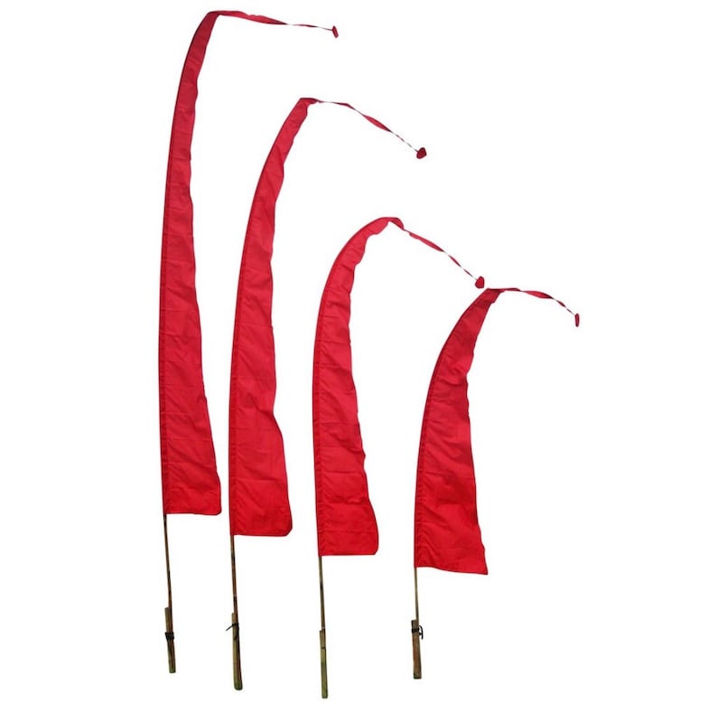 May include: Four red fabric flags with wooden poles. The flags are attached to the poles with clips. The flags are arranged in a descending size order from left to right.
