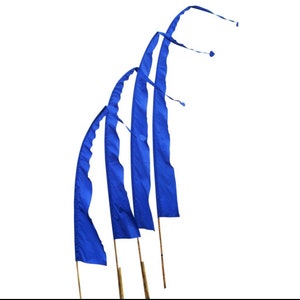 May include: Four blue pennants with pointed ends are attached to wooden poles. The pennants are arranged in a curved shape, with the tips of the pennants pointing towards the right side of the image.
