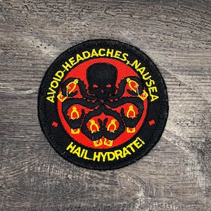 May include: A black and red embroidered patch with a yellow outline. The patch features a black octopus with a skull head and the text "AVOID HEADACHES, NAUSEA HAIL HYDRATE!"