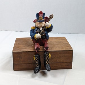 Dressed Solider Holding Flag with Dangling Legs Christmas Shelf Sitter