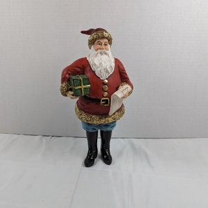 Santa Claus Holding Gift and List MMA