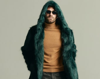 May include: A green faux fur hooded jacket with a brown turtleneck sweater and black jeans. The person is wearing sunglasses.