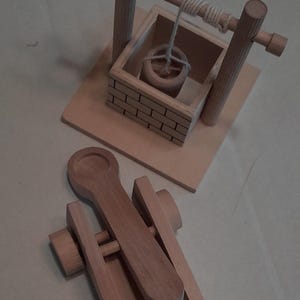 Toy well and catapult