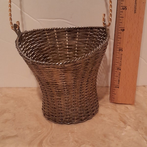 Vintage woven metal basket with handle