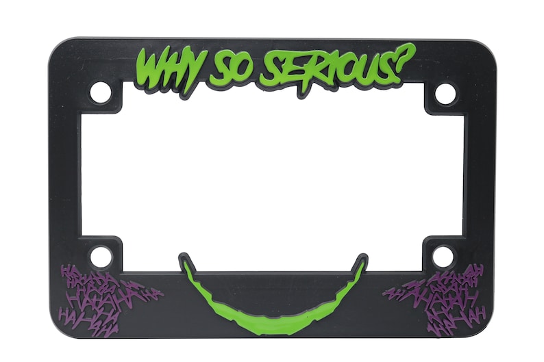 May include: Black plastic license plate frame with green and purple text that reads "WHY SO SERIOUS?" and a green and purple Joker-style smile.