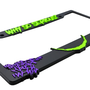 May include: Black license plate frame with a green "Why So Serious?" text and purple "HAHAHA" text.