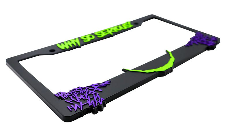 May include: Black license plate frame with a green "Why So Serious?" text and purple "HAHAHA" text.