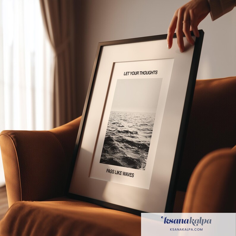 May include: A black framed wall art print featuring a monochrome photograph of ocean waves. The text LET YOUR THOUGHTS is printed above the image and PASS LIKE WAVES is printed below the image in a clean, black sans-serif font.
