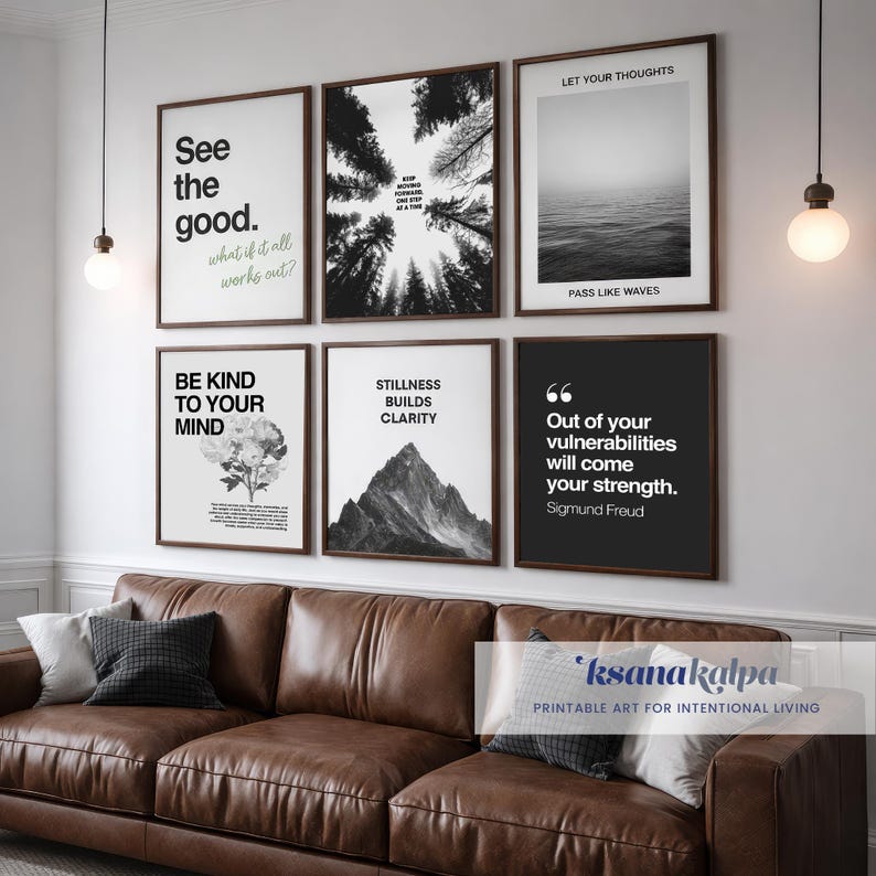 May include: A gallery wall arrangement featuring six framed prints with inspirational quotes and nature-themed imagery. The prints include phrases like "See the good" and "Stillness builds clarity." The frames are dark brown, and the wall is above a brown leather sofa.