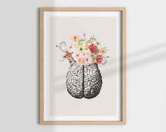 Könnte beinhalten: Ein gerahmter Druck eines menschlichen Gehirns mit einem Strauß bunter Blumen, die aus der Oberseite wachsen. Das Gehirn ist in einem Vintage-anatomischen Stil dargestellt, während die Blumen in Aquarelltechnik gemalt sind.
