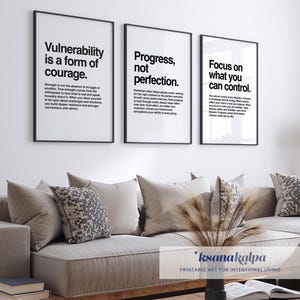 May include: Three framed prints with motivational quotes: "Vulnerability is a form of courage," "Progress, not perfection," and "Focus on what you can control." The prints are displayed above a beige sofa with decorative pillows. The overall theme is inspirational home decor.