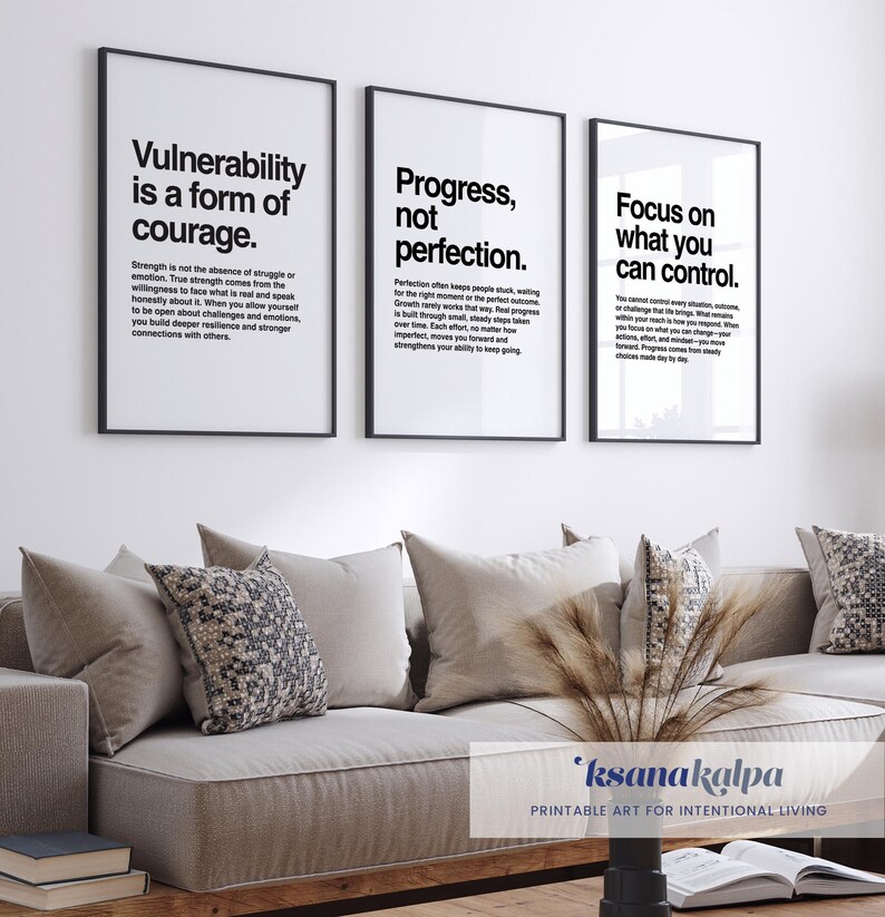 May include: Three framed prints with motivational quotes: "Vulnerability is a form of courage," "Progress, not perfection," and "Focus on what you can control." The prints are displayed above a beige sofa with decorative pillows. The overall theme is inspirational home decor.