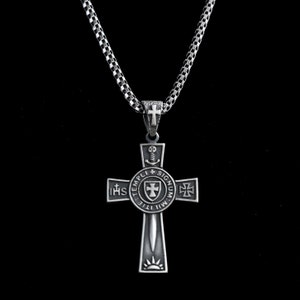 May include: A silver chain necklace with a silver cross pendant. The cross features a circular design with the words "TEMPLI MILITIE SIGNUM" and "IHS" in a circle around a sword and shield.