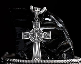 May include: Silver pendant necklace with a cross design. The cross features a sword, a shield, and the words "TEMPLI MILITIE SIGNUM" and "IHS".