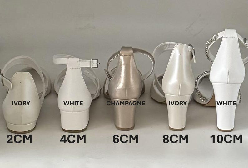 May include: Five pairs of bridal heels in ivory, white, and champagne colors. The heels are 2 cm, 4 cm, 6 cm, 8 cm, and 10 cm high.
