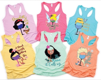 Puede incluir: Seis camisetas de tirantes de colores con diferentes personajes de princesas Disney y diseños de copas de vino. El texto en las camisetas incluye "Drink Like a Princess", "A Drink Worth Fighting For", "The Wine It Calls Me", "Let It Flow", "Drunk Like a Princess", y "Let It Flow".