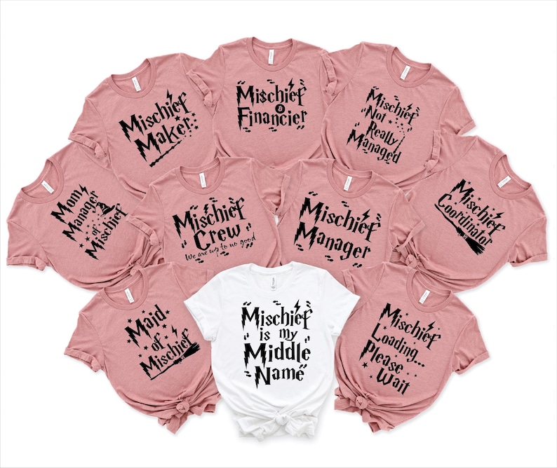 May include: A set of ten pink t-shirts with black text and graphics. The shirts feature various phrases related to mischief, including "Mischief Maker", "Mischief Financier", "Mischief Crew", "Mischief Manager", "Mischief Coordinator", "Maid of Mischief", "Mischief is my Middle Name", and "Mischief Loading... Please Wait".