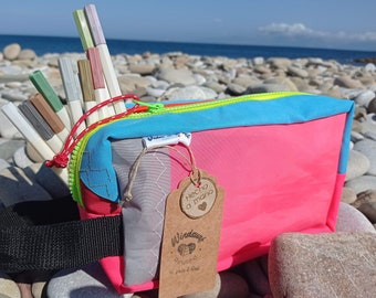 Unique multi-use case, made with recycled windsurf sails with a lot of history, wind, salt and sea. Handmade with love, passion and respect