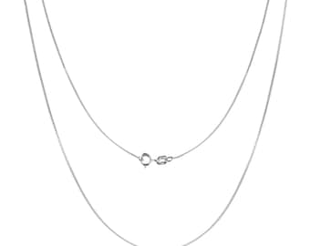 May include: A silver chain necklace with a lobster clasp. The chain is made of small, delicate links.