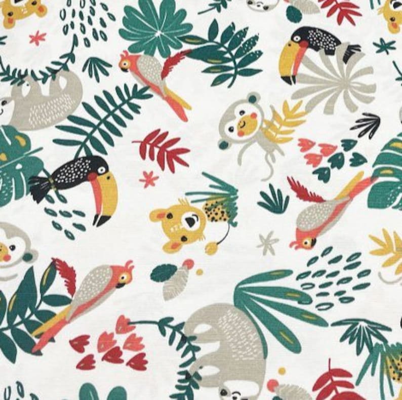May include: A white fabric with a repeating pattern of jungle animals and plants. The animals include toucans, sloths, monkeys, and parrots. The plants are green and red.