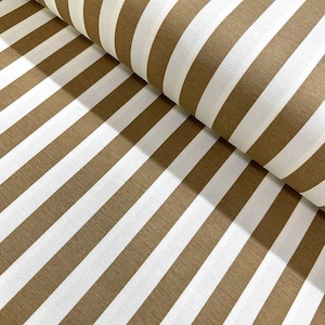 May include: Brown and white striped fabric. The fabric is folded in half, showing the stripes running diagonally.